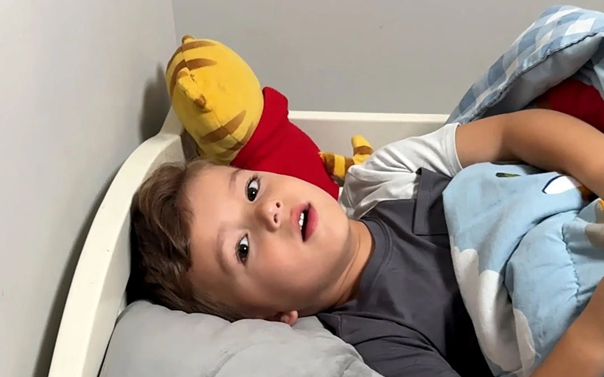 Children yawning in bed at bedtime