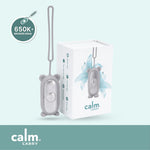Grey CalmCarry device with packaging on a light blue background