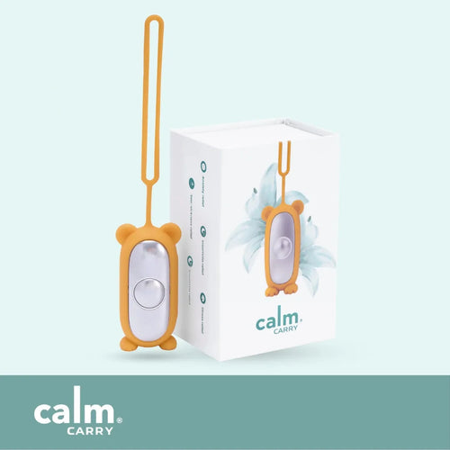 Orange CalmCarry Kids device with its box