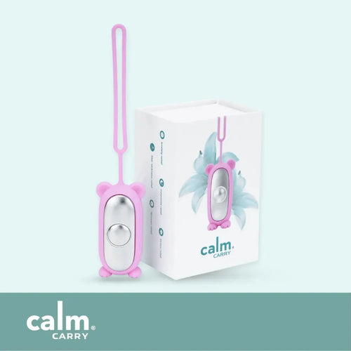Pink CalmCarry Kids device with its box