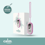Pink CalmCarry device with packaging on a light blue background